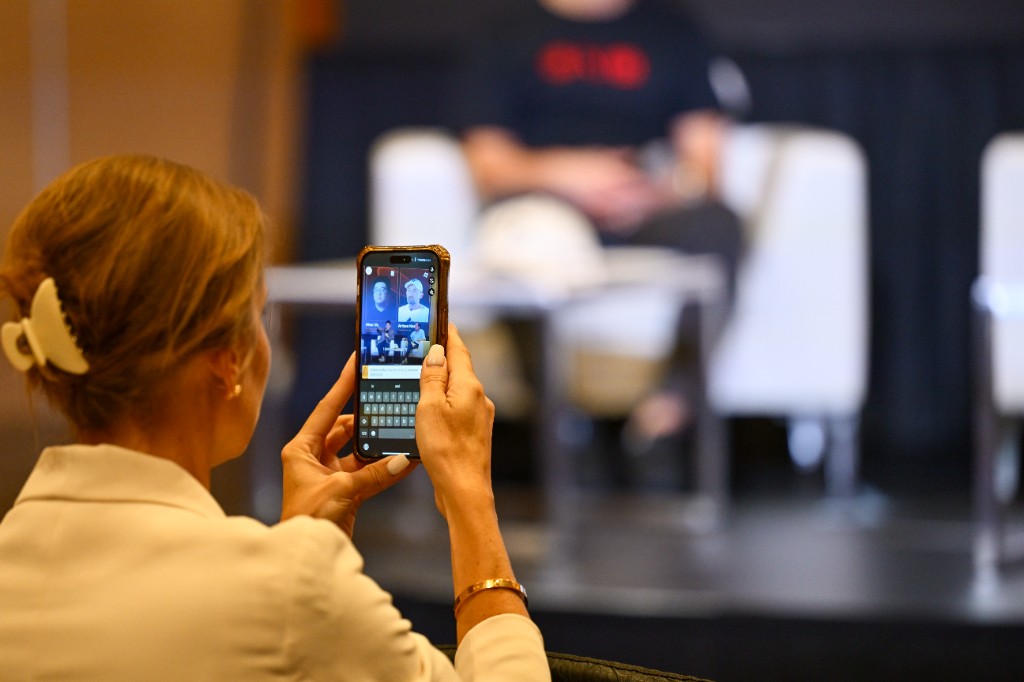 Token2049 audience filming the stage